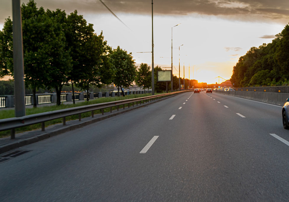 Driving down a city road at sun down